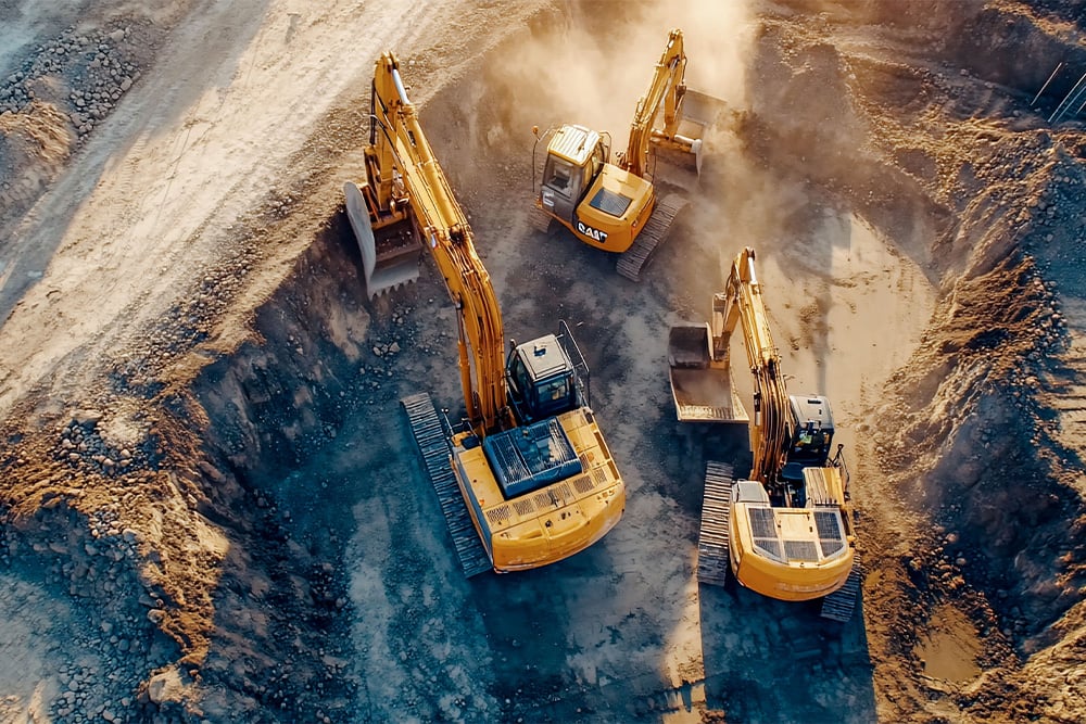 Drei Bagger in der Grube