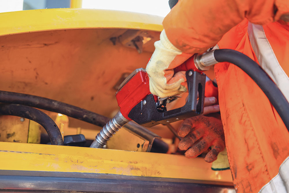 Arbeiter/in mit Zapfhahn